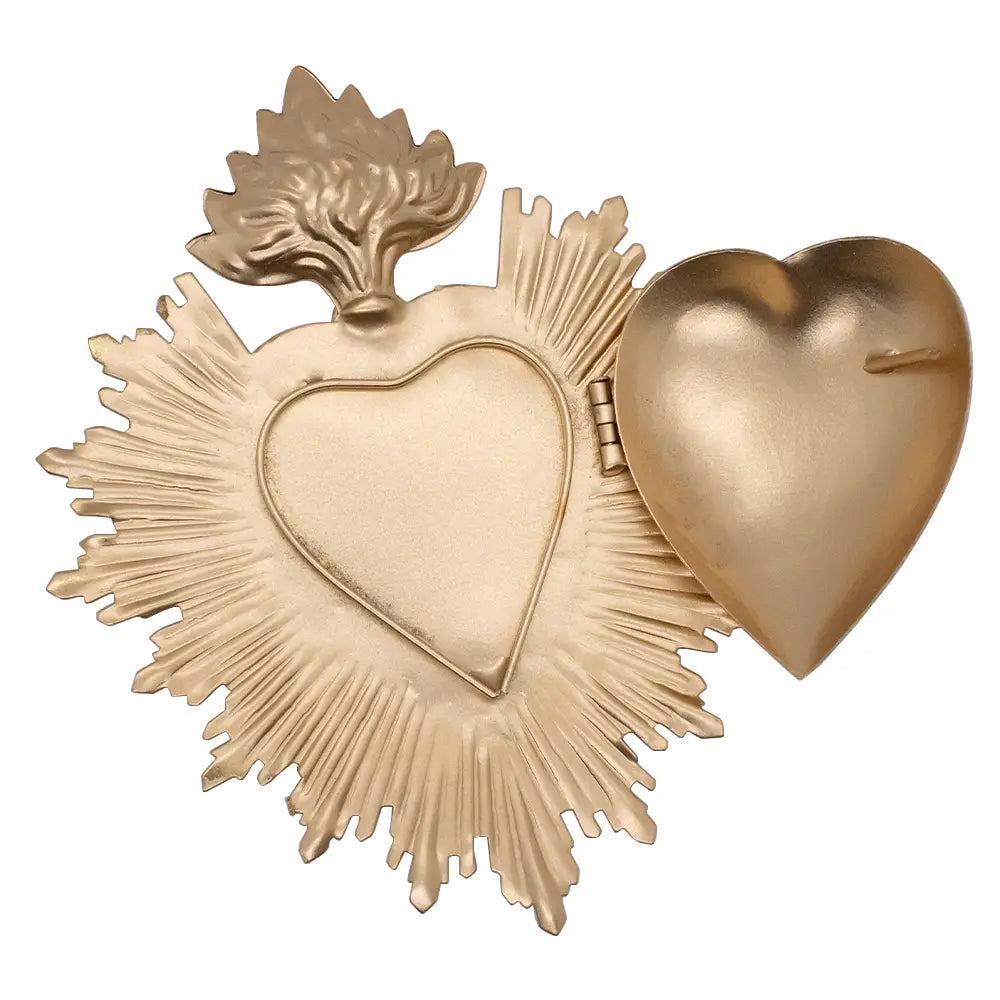 Gold brass sacred heart with a flame top and sunburst edge, hinged open to show the hollow interior.