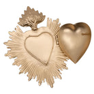 Gold brass sacred heart with a flame top and sunburst edge, hinged open to show the hollow interior.