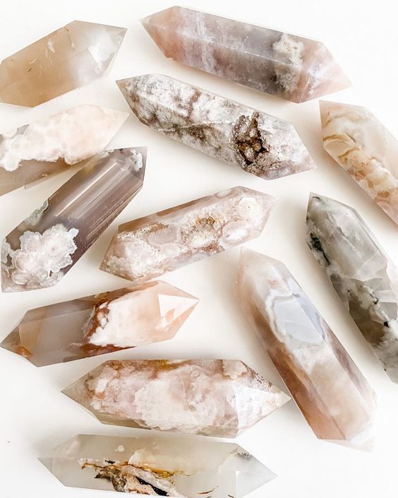 Neutral-toned healing crystal points with natural marbling and elevated bohemian spiritual aesthetic.