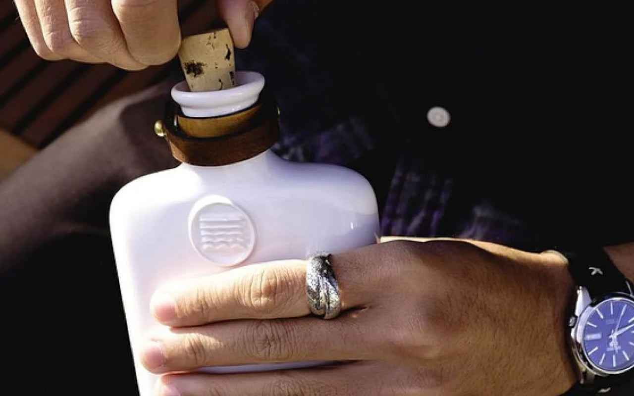Luxury whiskey smoker gift set styled with modern masculine accessories and elevated cocktail aesthetic.